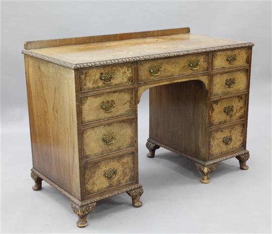 A crossbanded walnut kneehole desk, W.3ft 10in. D.1ft 10in. H.2ft 8in.